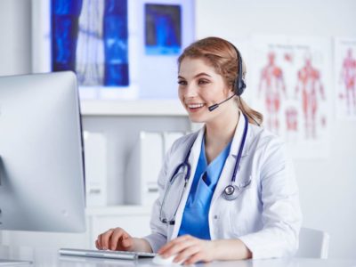 Portrait,Of,A,Happy,Smiling,Young,Doctor,In,Headset,In